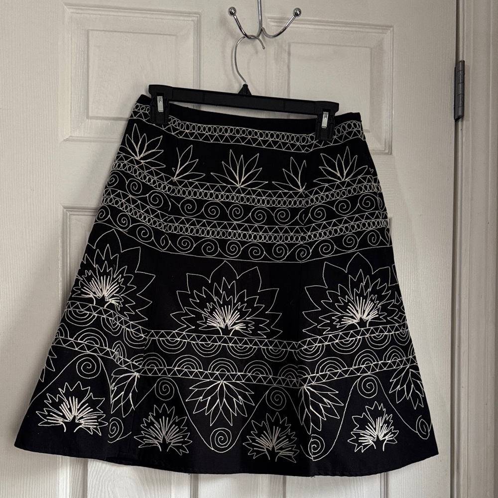 Like new Talbots knee length skirt. Black with beige embroidery, size 6